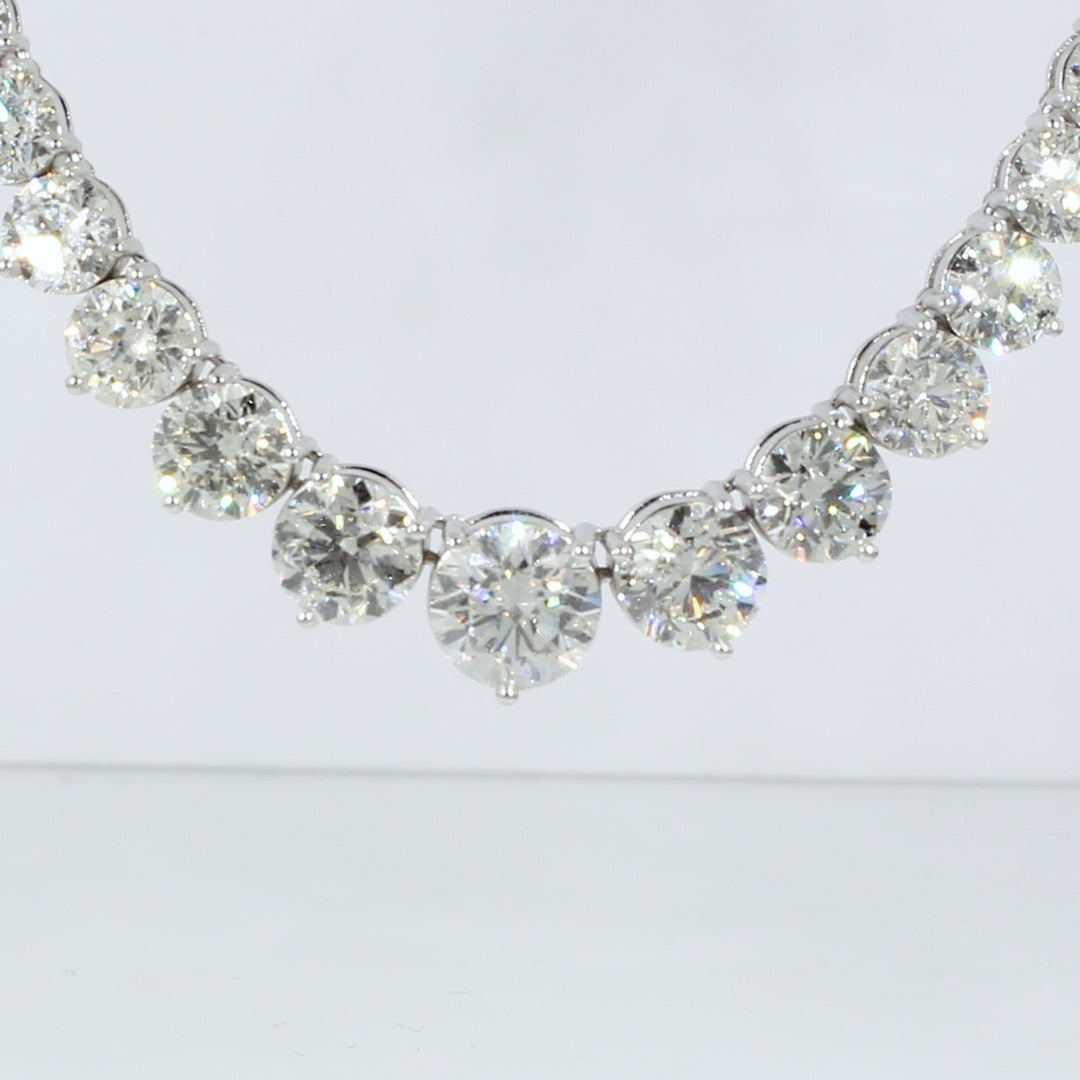 17"" Graduated tennis necklace in platinum with 3-prong set round diamonds.  D28.55ct.t.w.  (Center 2.04ct.)