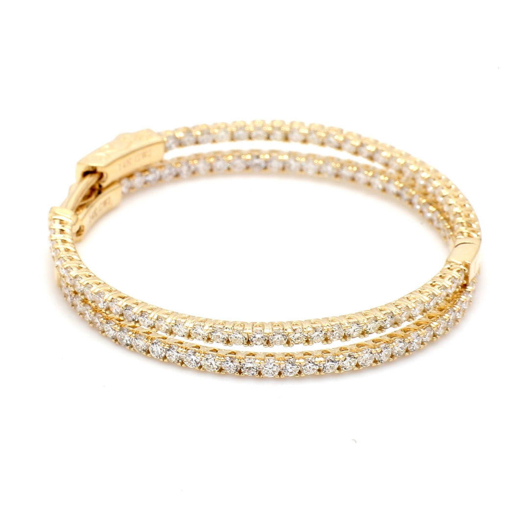 1.5"" Inside out hoop earrings with prong set round diamonds.  D1.83ct.t.w.