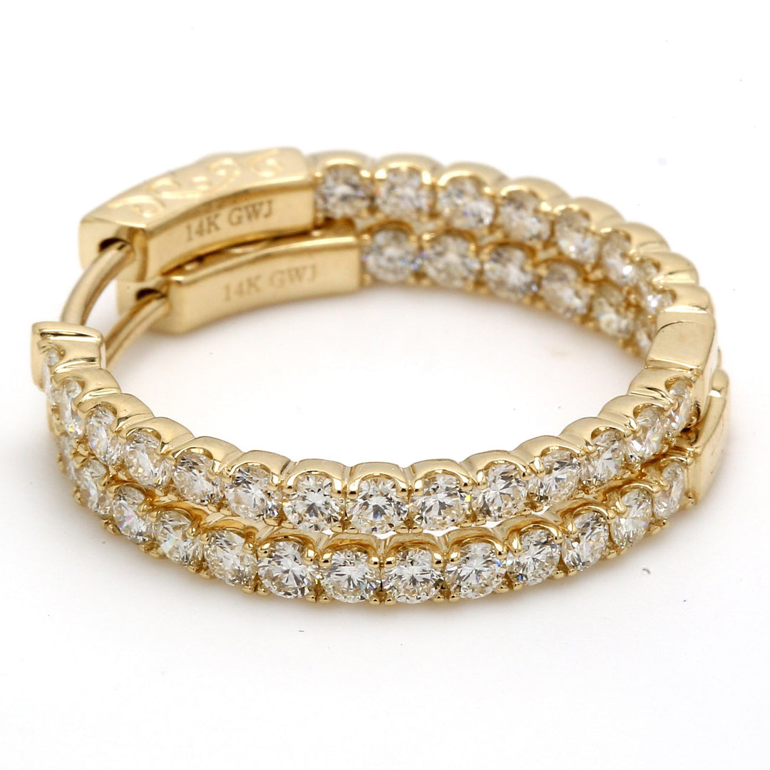 1"" Inside out hoop earrings with prong set round diamonds.  D1.61ct.t.w.