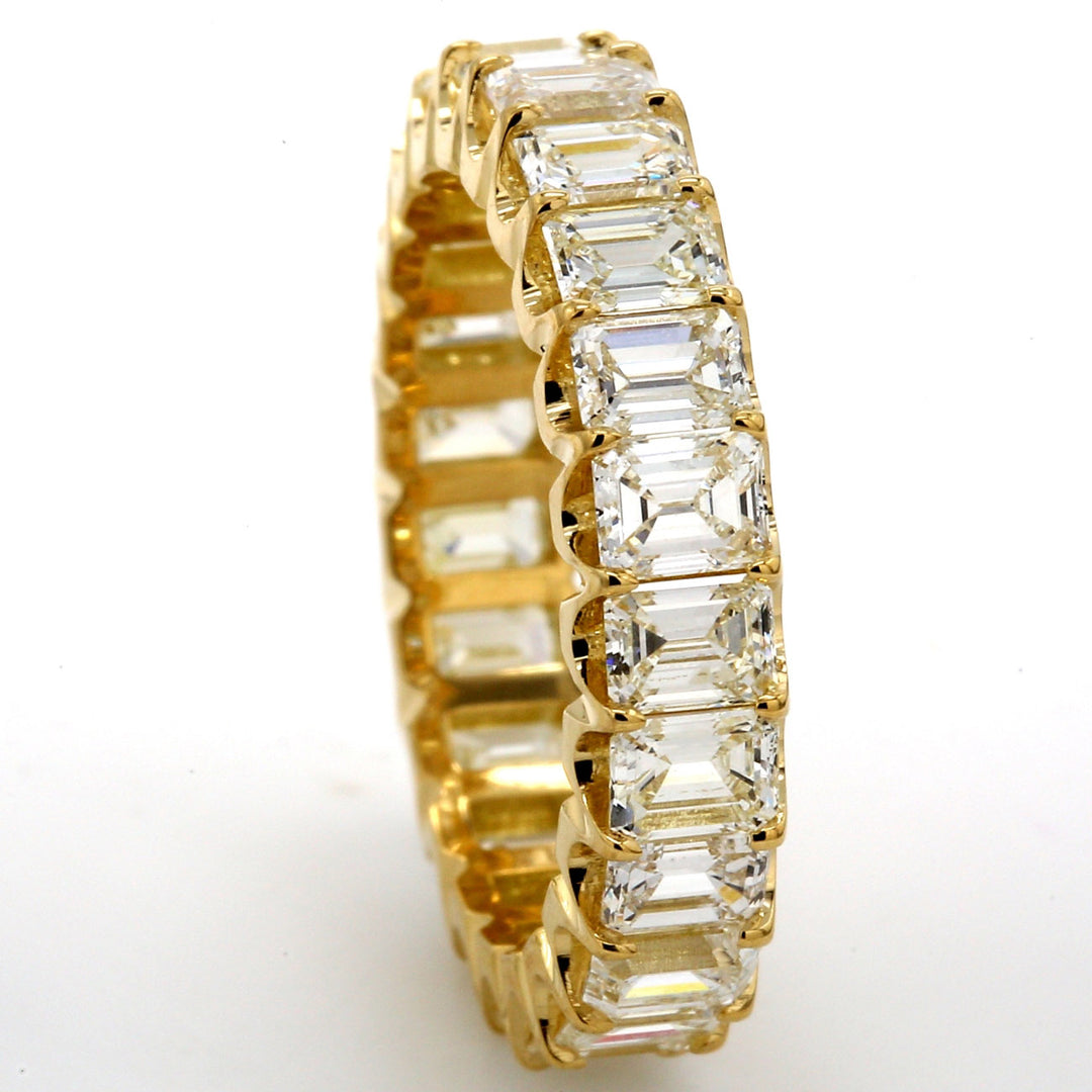 Eternity band in 18K YG with U-prong set (23) emerald cut diamonds.  D3.82ct.t.w.  Size 6