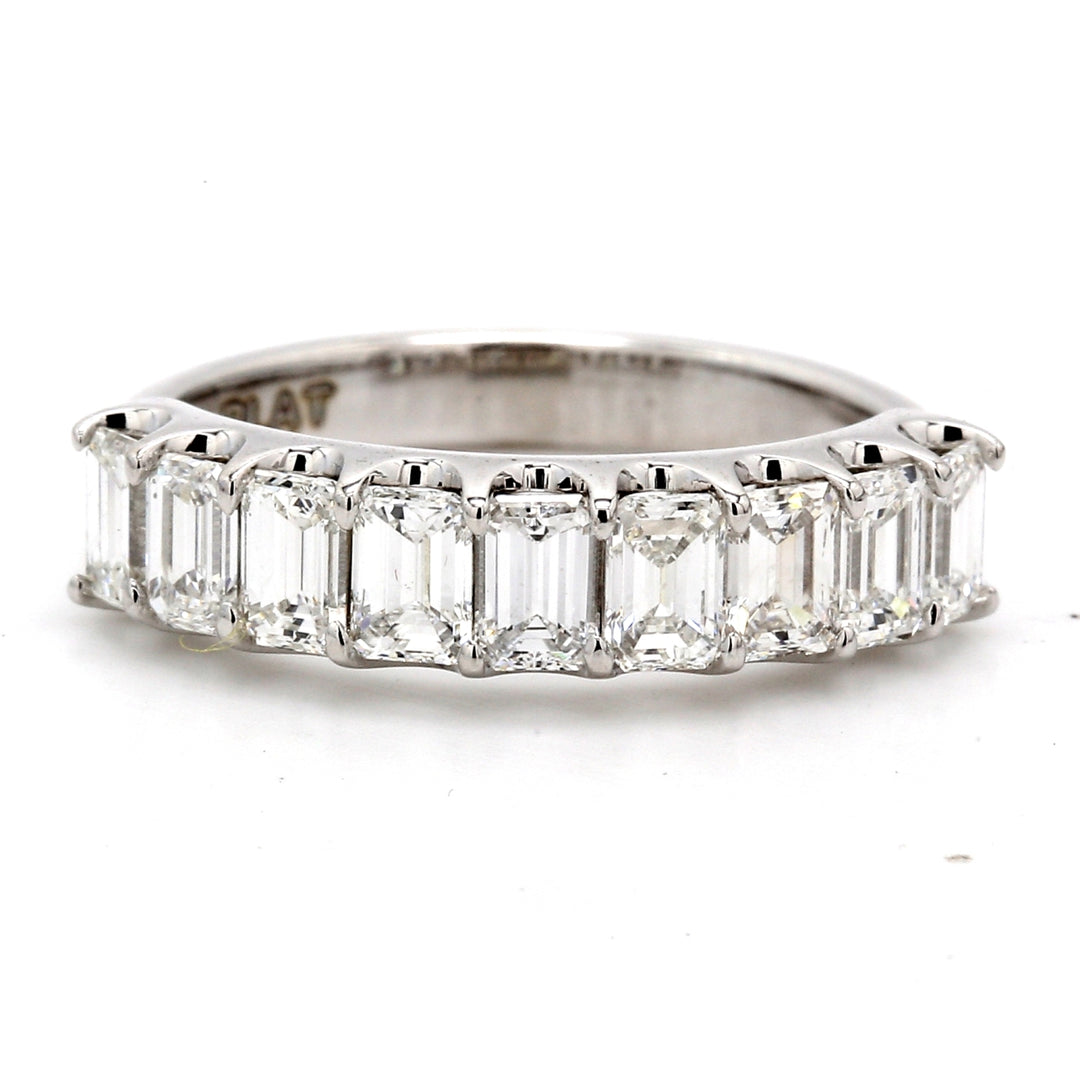 9-stone band in platinum with U-prong set emerald cut diamonds.  D1.64ct.t.w.  Size 6.5