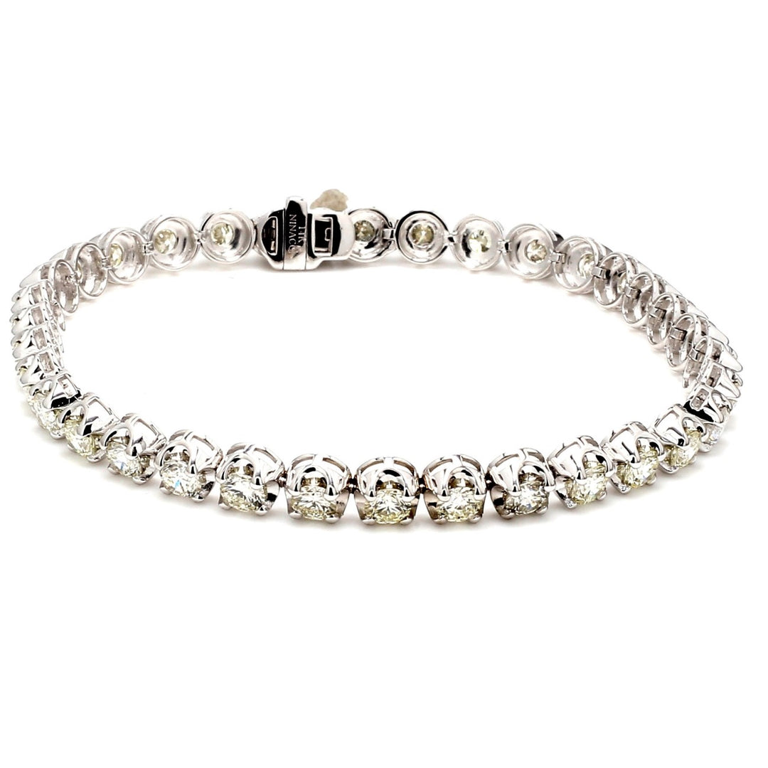 7"" Tennis bracelet with crown head prong set (34) round diamonds.  D6.27ct.t.w.