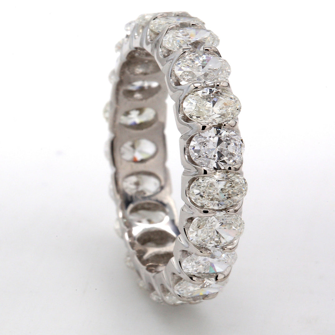 Eternity band in platinum with U-prong set (21) oval diamonds.  D4.05ct.t.w.  Size 7