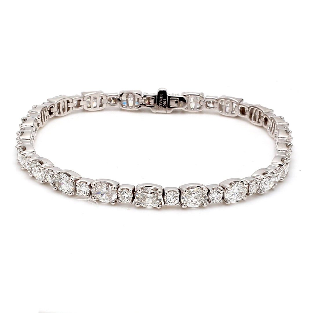 7"" Tennis bracelet in 18K WG with prong set round and oval diamonds.  D10.08ct.t.w.