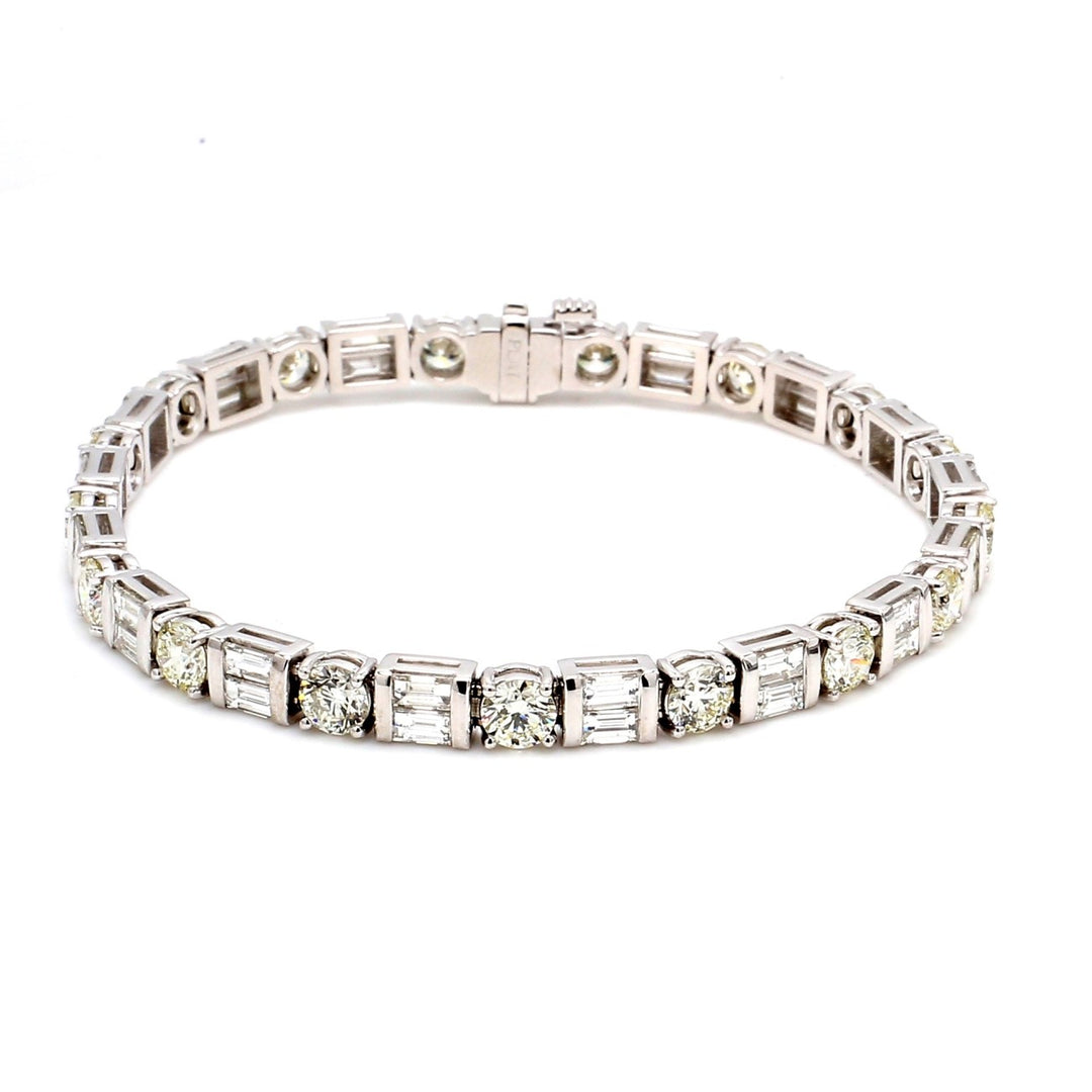 7.5"" Tennis bracelet in platinum with basket prong set (18) rounds and channel set (36) baguette diamonds.  D9.56ct.t.w.