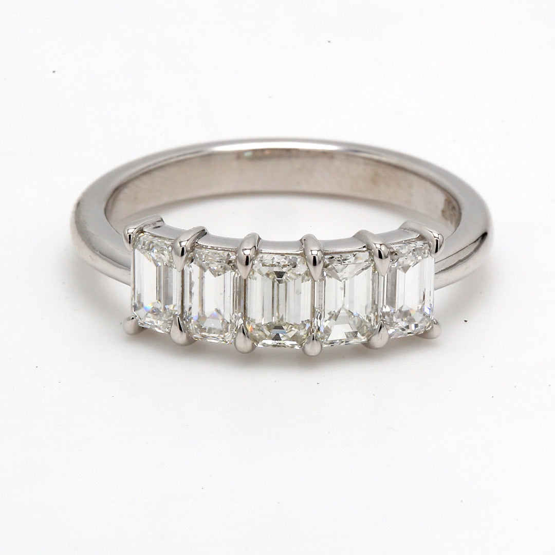 5-stone band in platinum with prong set emerald cut diamonds.  D1.36ct.t.w.  Size 6.5