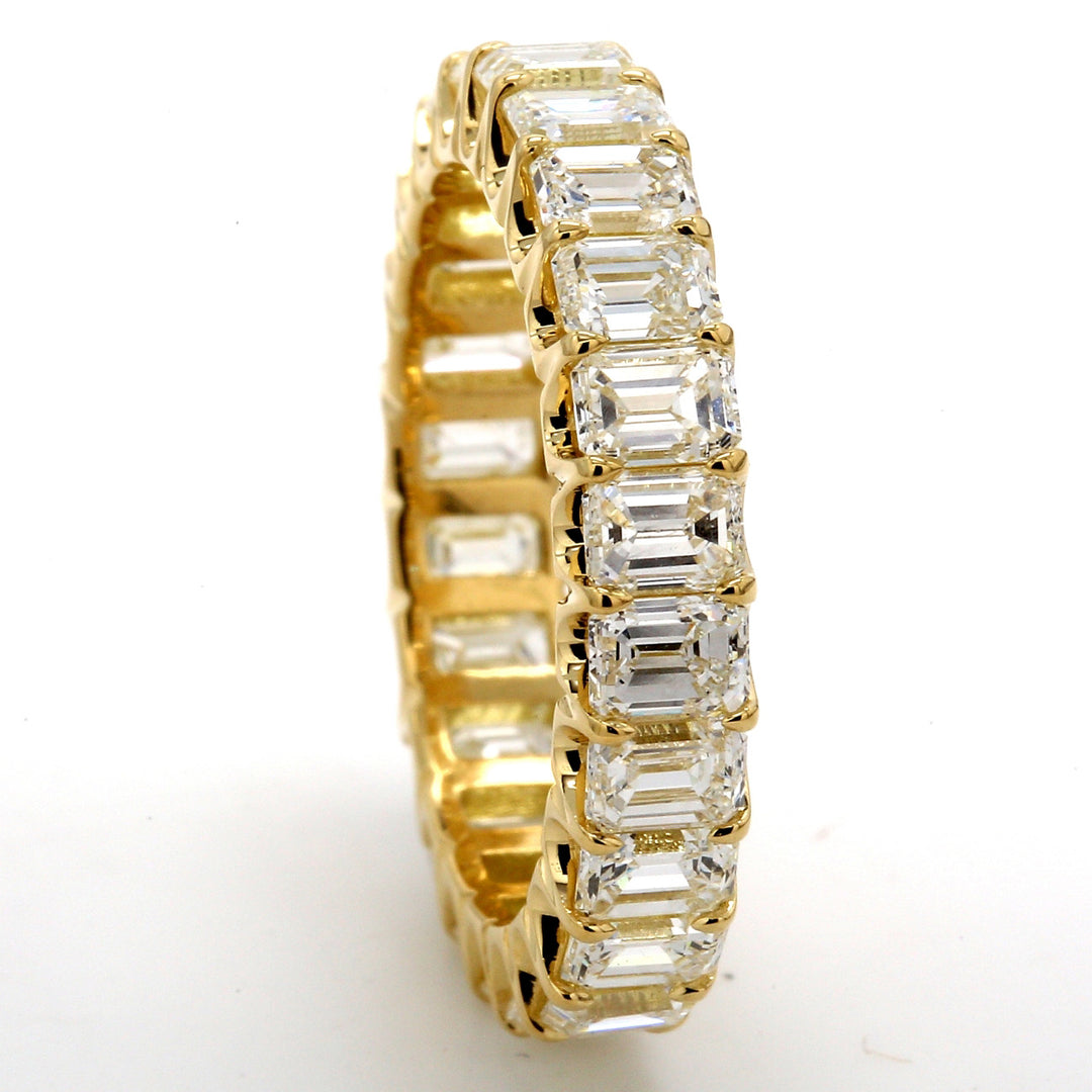Eternity band in 18K YG with U-prong set (24) emerald cut diamonds.  D4.50ct.t.w.  Size 6.75