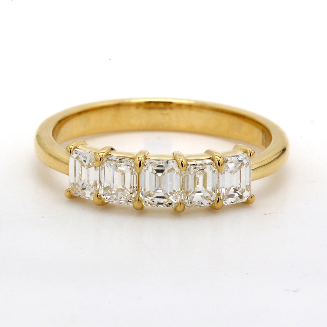 5-stone band in 18K YG with prong set emerald cut diamonds.  D1.10ct.t.w.  Size 6
