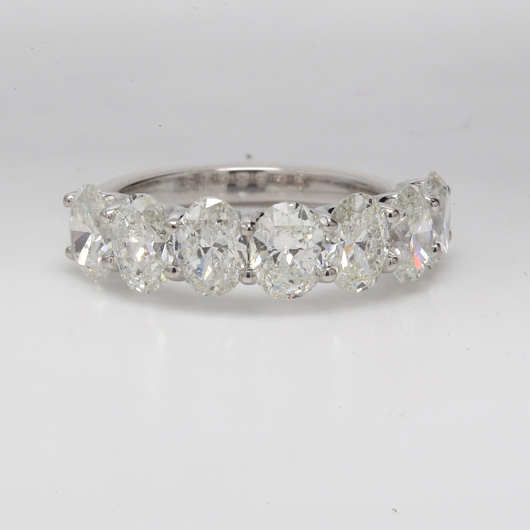 7-stone band with U-prong set GIA certified G-H /SI1-SI2 oval diamonds.  D3.51ct.t.w.  Size 6.75