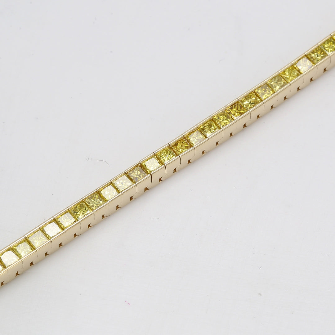 7"" Tennis bracelet in 14K YG with channel set princess cut yellow diamonds.  D4.41ct.t.w.
