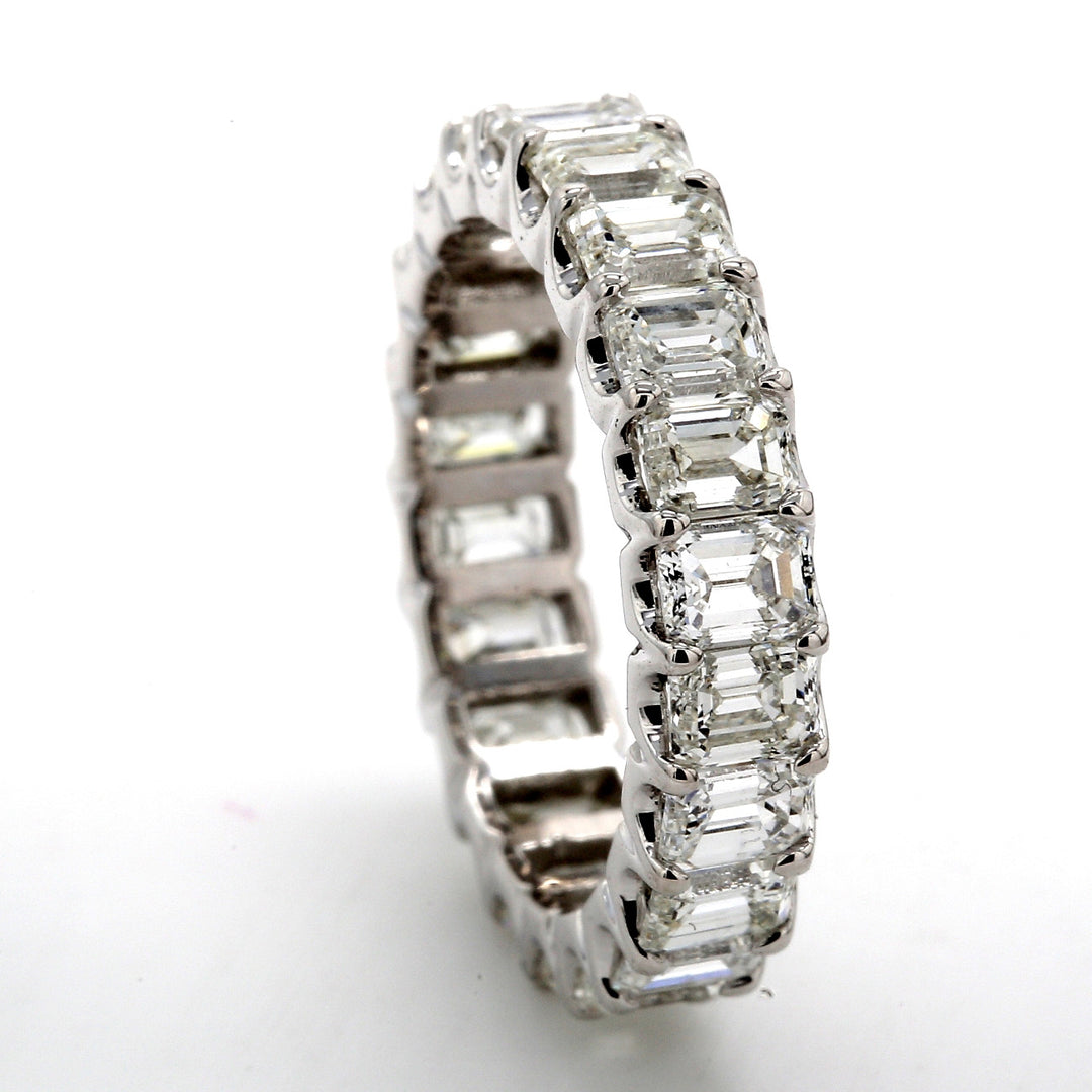 Eternity band in platinum with U-prong set (22) emerald cut diamonds.  D4.29ct.t.w.  Size 5.5
