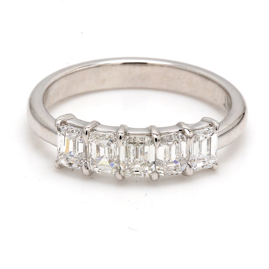5-stone band in platinum with prong set emerald cut diamonds.  D1.15ct.t.w.  Size 5.75