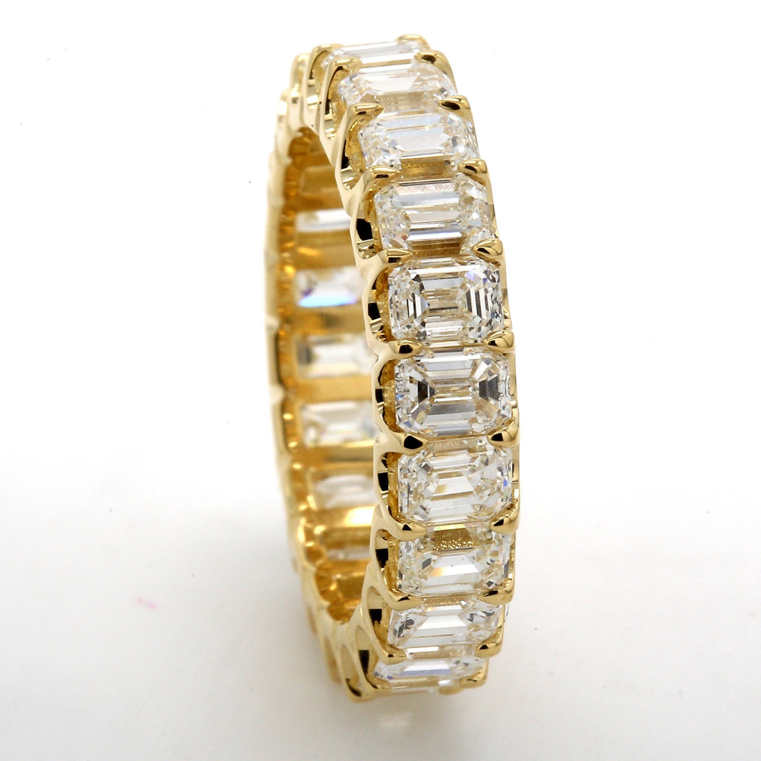 Eternity band in 18K YG with U-prong set (22) emerald cut diamonds.  D4.93ct.t.w.  Size 6