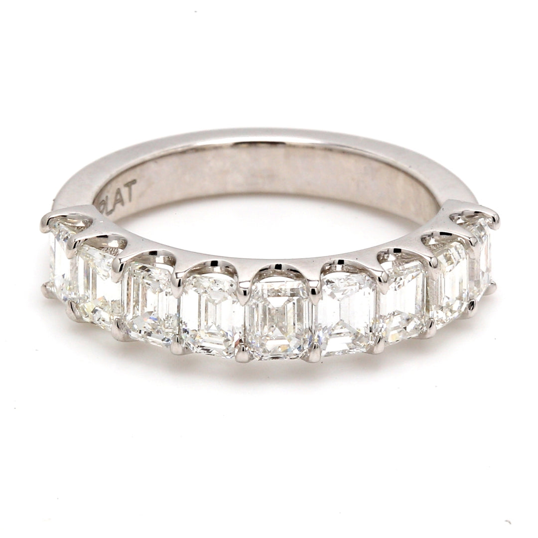 9-stone band in platinum with U-prong set emerald cut diamonds.  D1.80ct.t.w.  Size 5