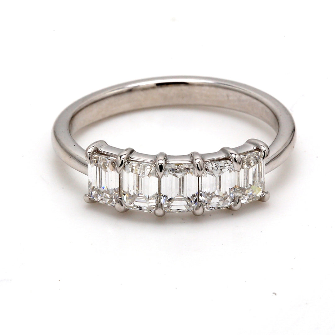 5-stone band in platinum with prong set emerald cut diamonds.  D1.19ct.t.w.  Size 5.5