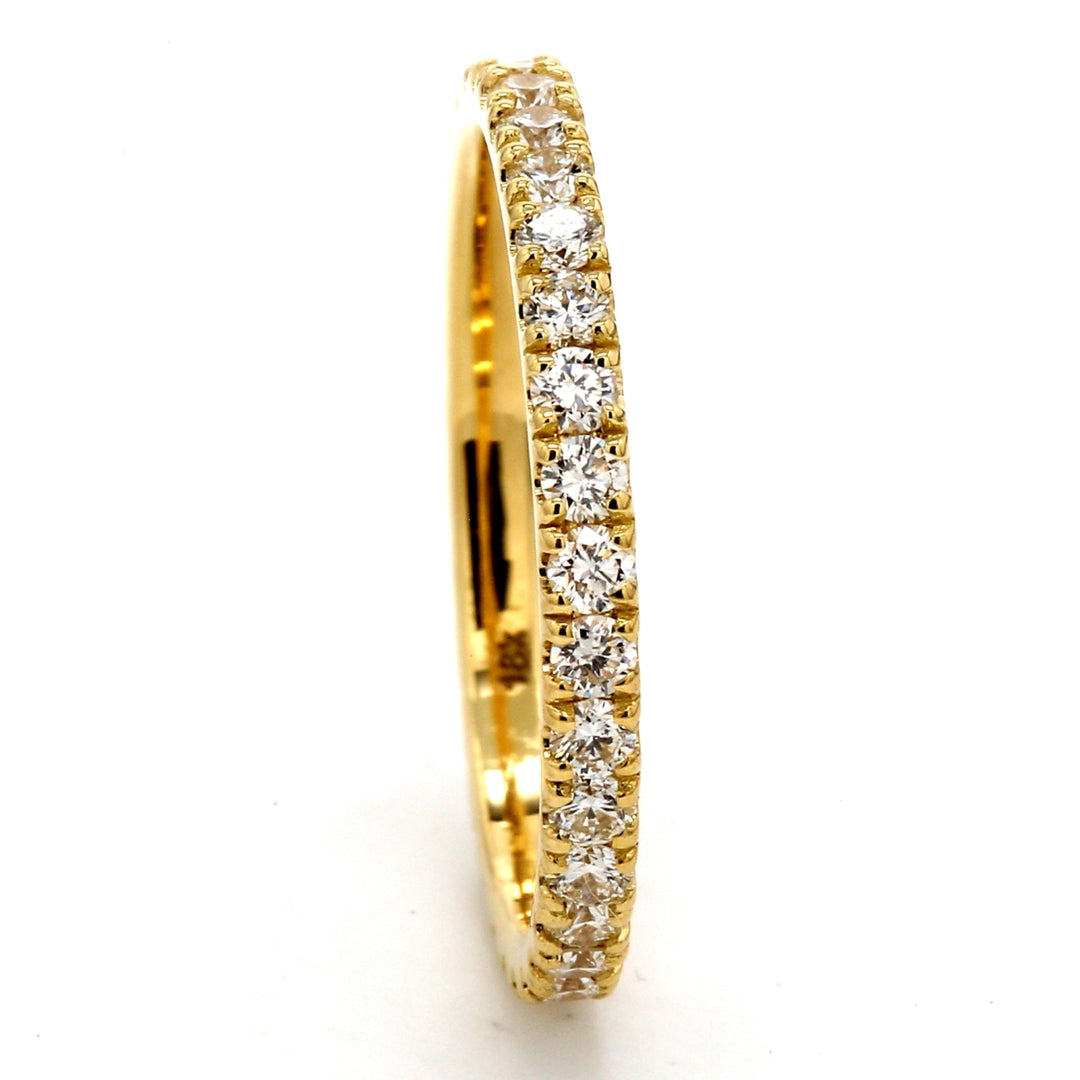 Eternity band in 18K YG with 4-prong set (30) round diamonds.  D0.75ct.t.w.  Size 5