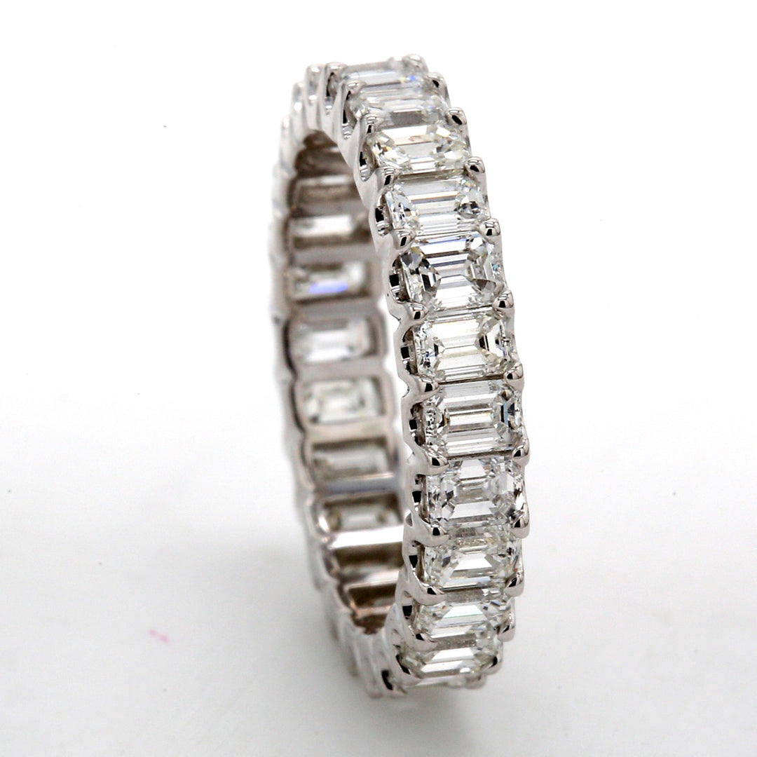 Eternity band in platinum with U-prong set (26) emerald cut diamonds.  D2.49ct.t.w.  Size 5
