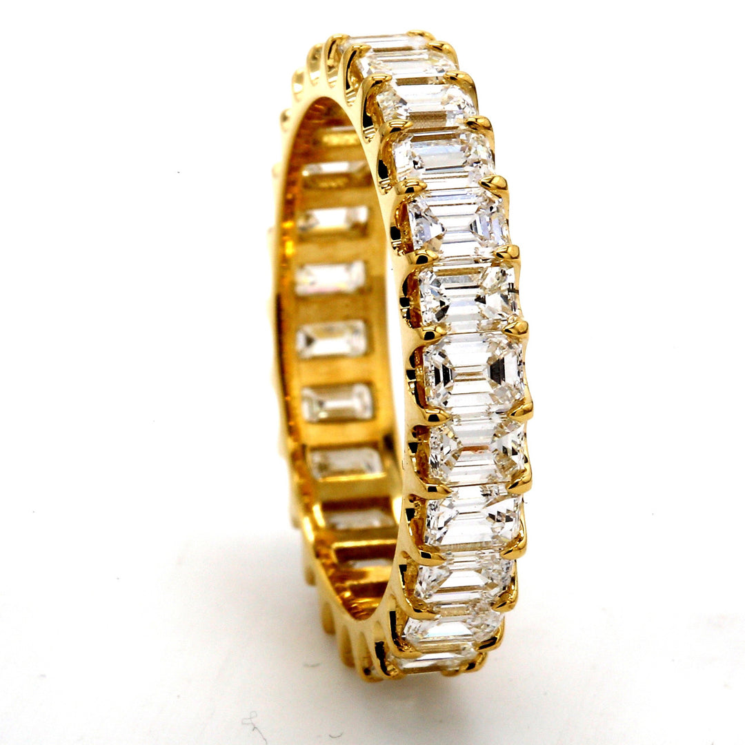 Eternity band in 18K YG with U-prong set (26) emerald cut diamonds.  D2.82ct.t.w.  Size 6.25