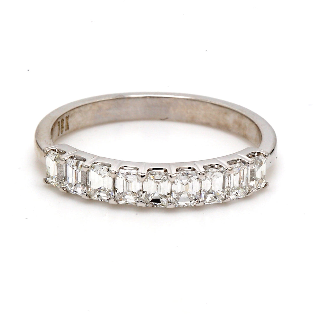 9-stone band in 18K WG with prong set emerald cut diamonds.  D0.85ct.t.w.  Size 8