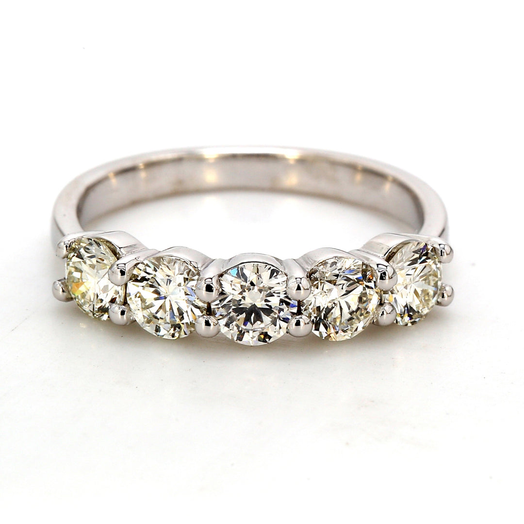 5-stone band in platinum with shared prong set round diamonds.  D1.27ct.t.w.  Size 6