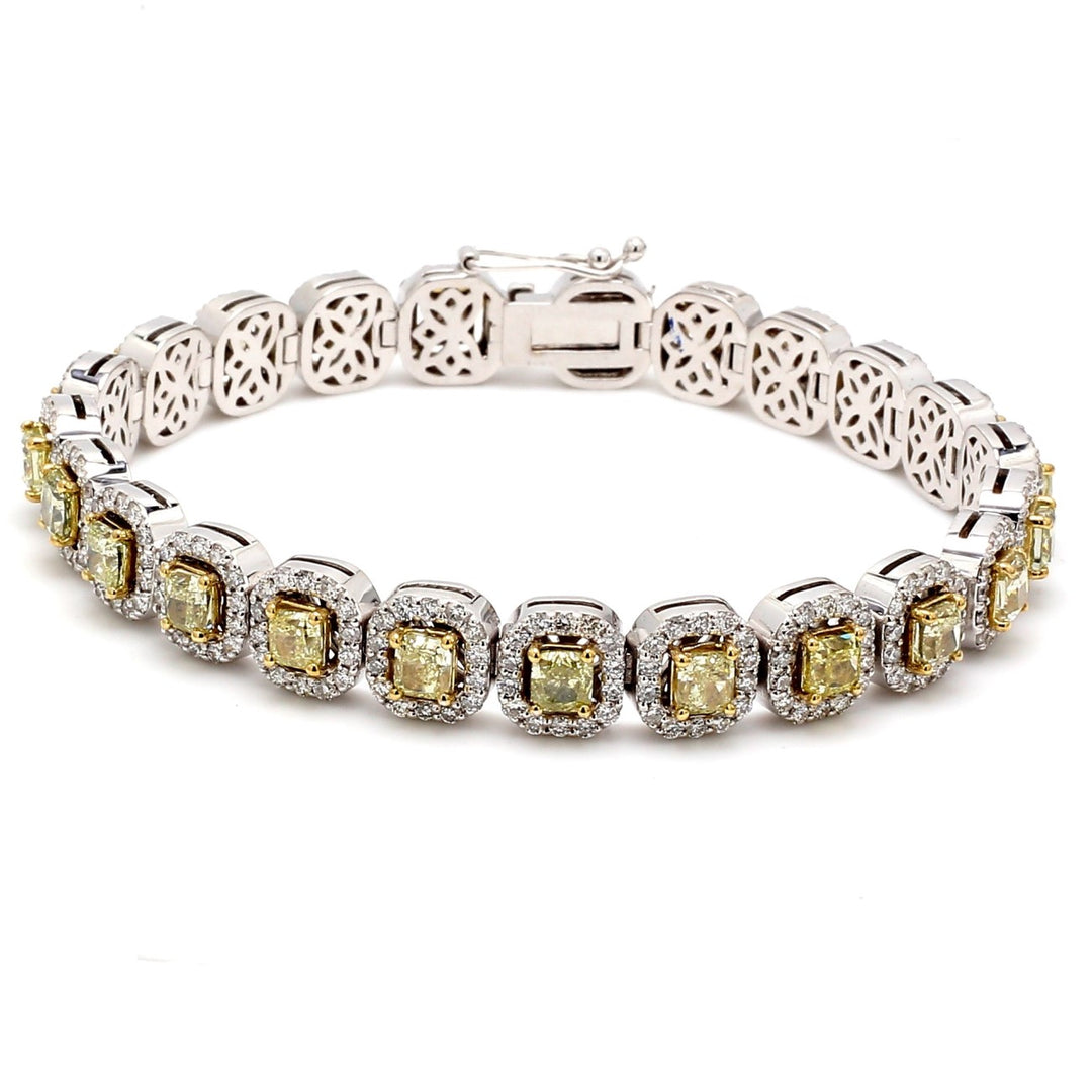 7"" Halo tennis bracelet in 18K WG with pre set rounds and fancy yellow cushion cut diamond centerstones.  D10.48ct.t.w.