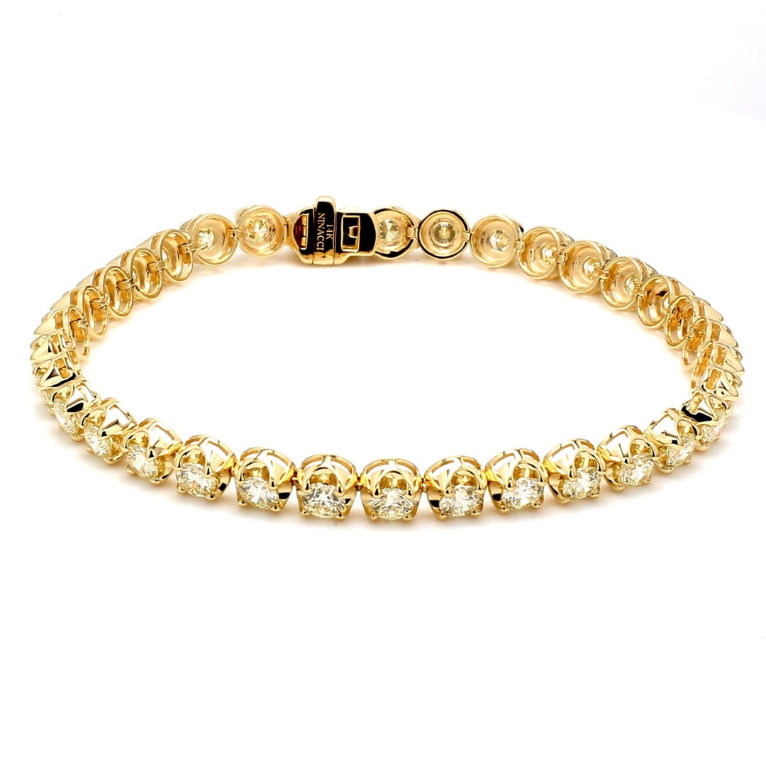 7"" Tennis bracelet in 14K YG with crown head prong set (34) round diamonds.  D6.47ct.t.w.