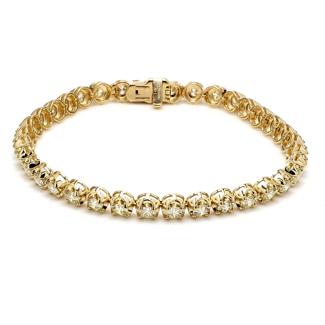 7"" Tennis bracelet in 14K YG with crown head prong set (36) round diamonds.  D5.21ct.t.w.