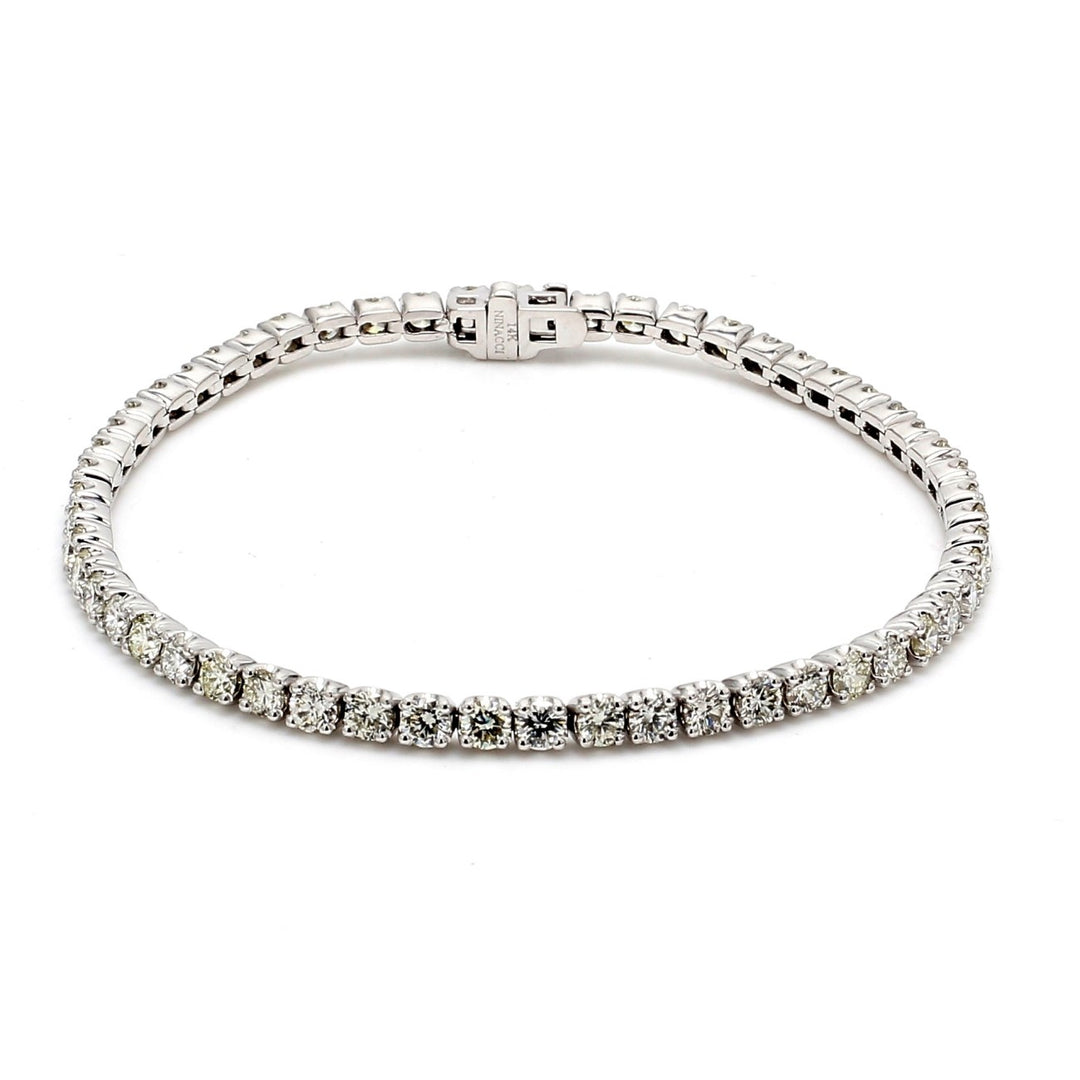 7"" Tennis bracelet with crown head prong set (55) round diamonds.  D5.38ct.t.w.