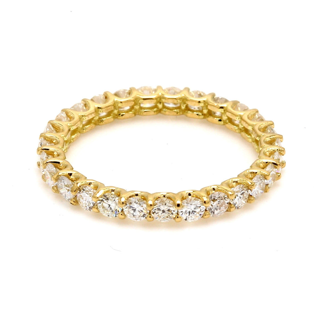 Eternity band in 18K YG with U-prong set (27) round diamonds.  D0.76ct.t.w.  Size 3.25