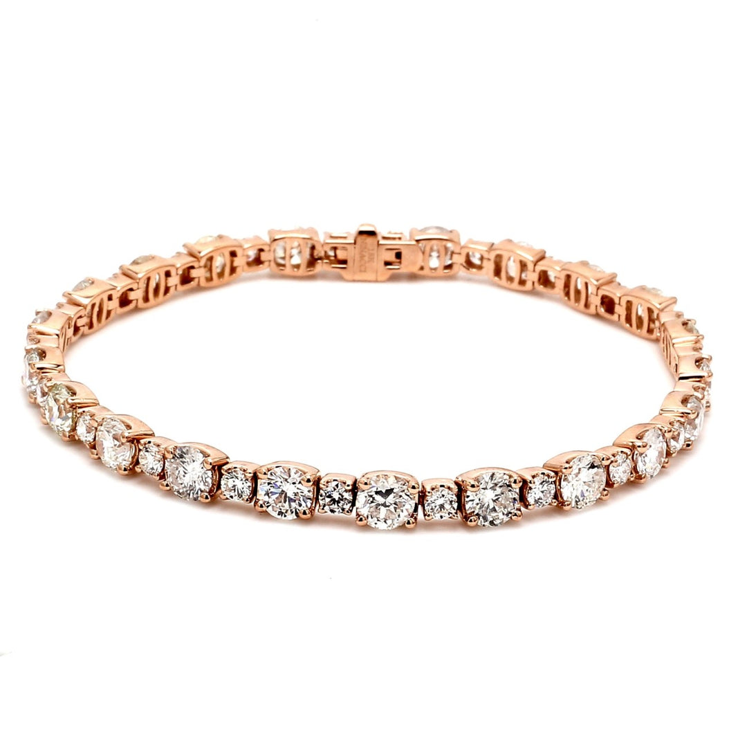 7"" Tennis bracelet in 18K RG with prong set alternating sized round diamonds.  D9.83ct.t.w.