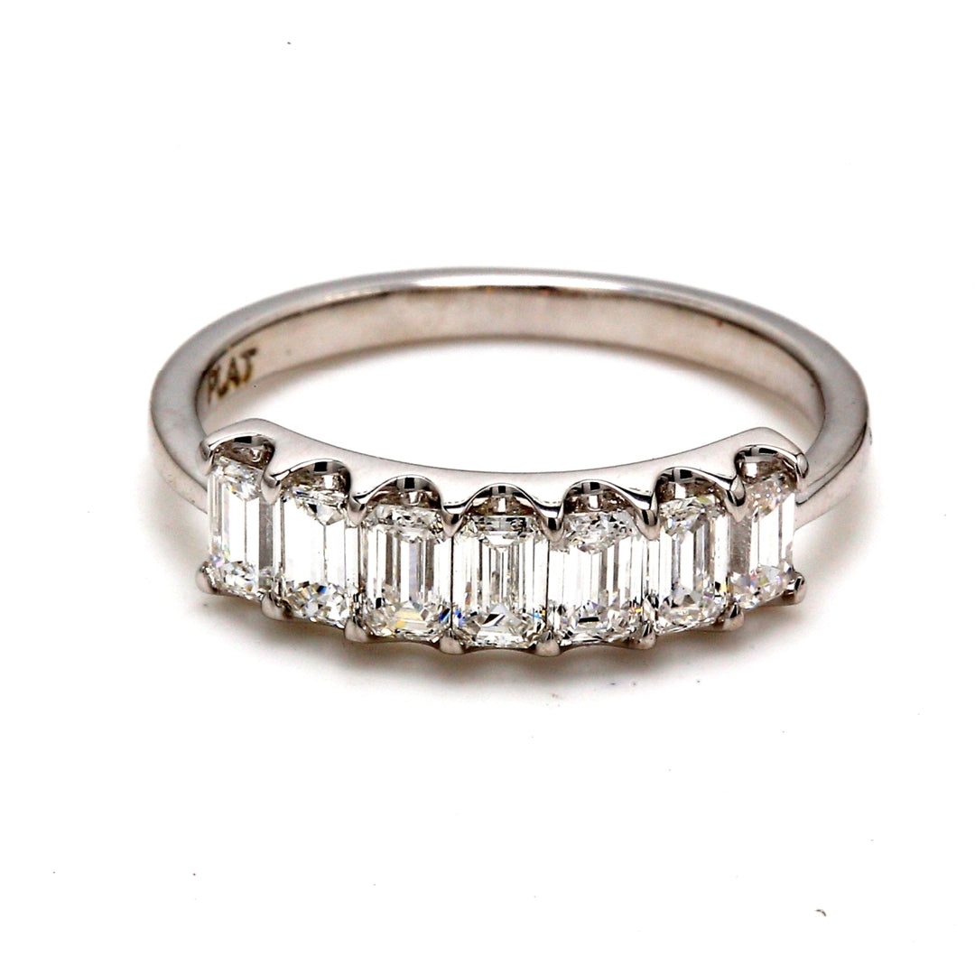 7-stone band in platinum with U-prong set emerald cut diamonds.  D0.96ct.t.w.  Size 6