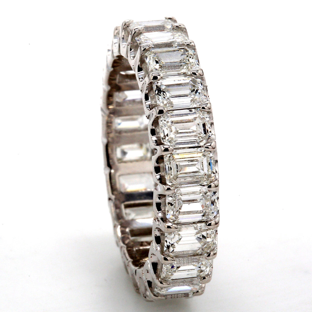 Eternity band in platinum with U-prong set (22) emerald cut diamonds.  D4.48ct.t.w.  Size 5.5
