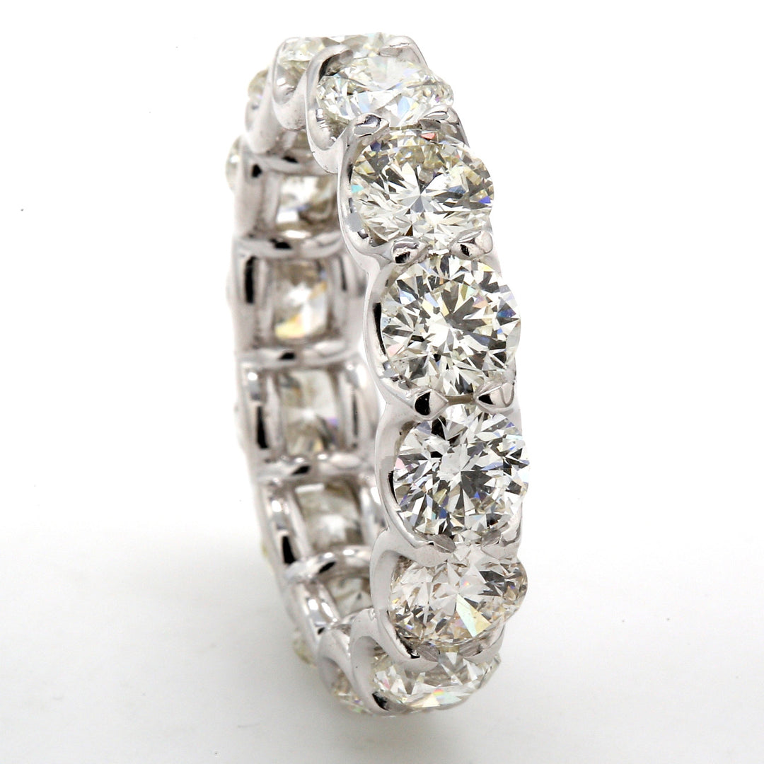 Eternity band in platinum with U-shape eagle claw set (14) round diamonds.  D5.62ct.t.w.  Size 6.25