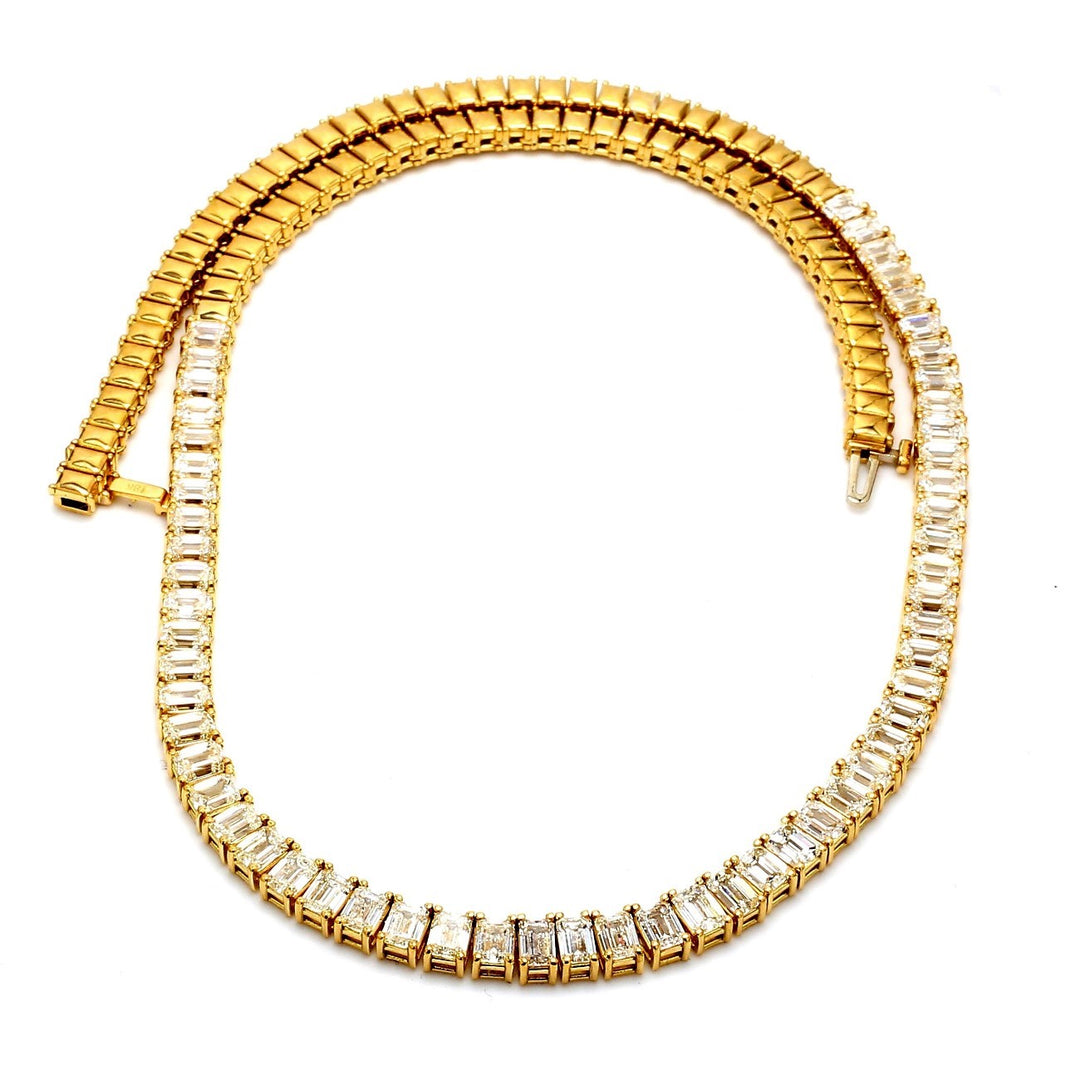 16.25"" Halfway graduating tennis necklace in 18K YG with  4-prong set (56) emerald cut diamonds.  D16.94ct.t.w.