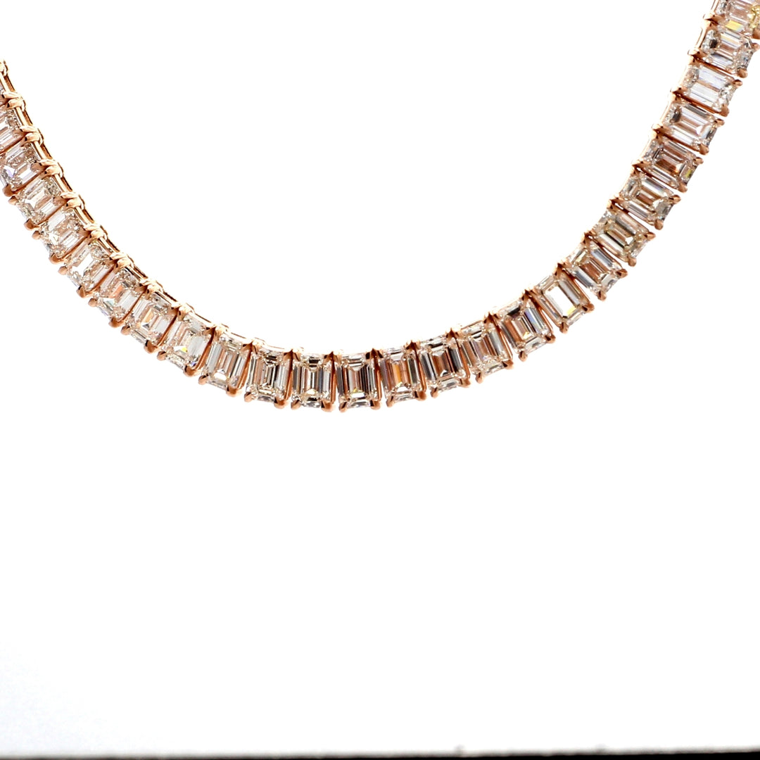 16"" Half way graduated tennis necklace in 18K RG with 4-prong basket set (56) emerald cut diamonds.  D17.06ct.t.w.