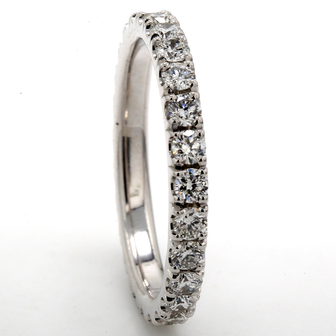 Eternity band in platinum with shared prong set (26) round diamonds.  D1.83ct.t.w.  Size 9.75