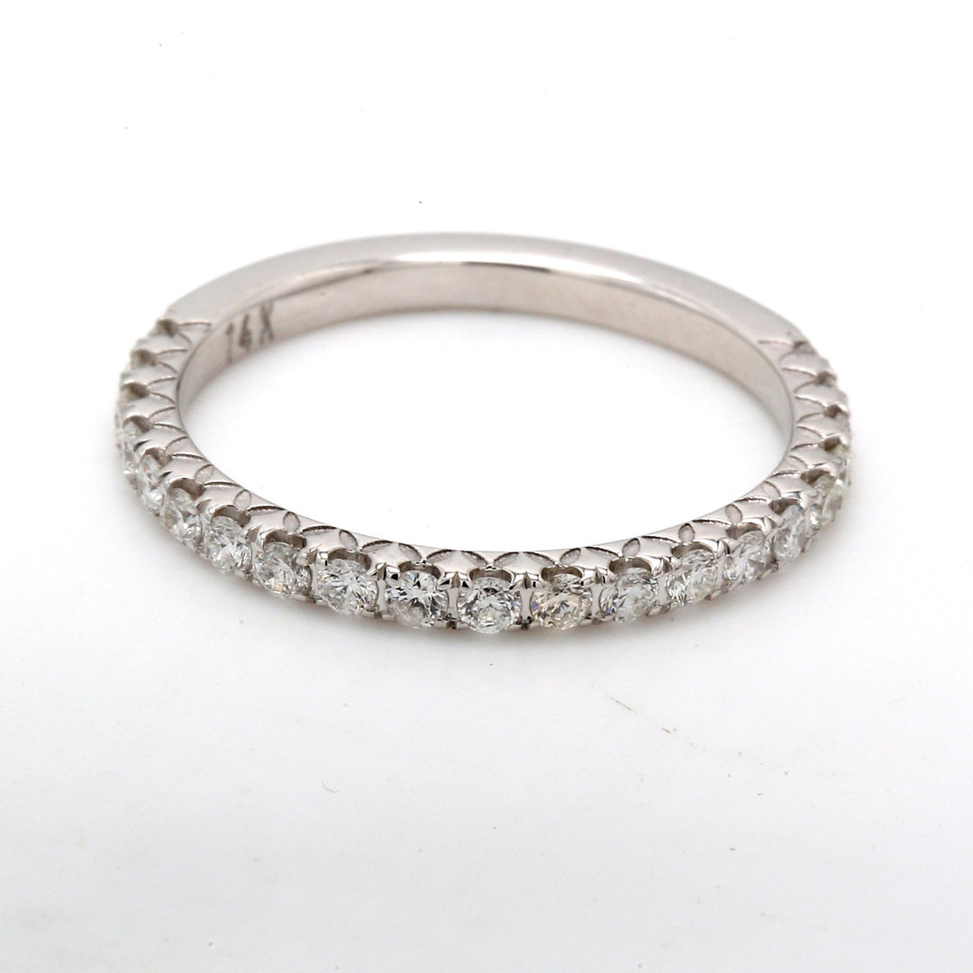 Band with prong set (21) round diamonds.  D0.52ct.t.w.  Size 8.5