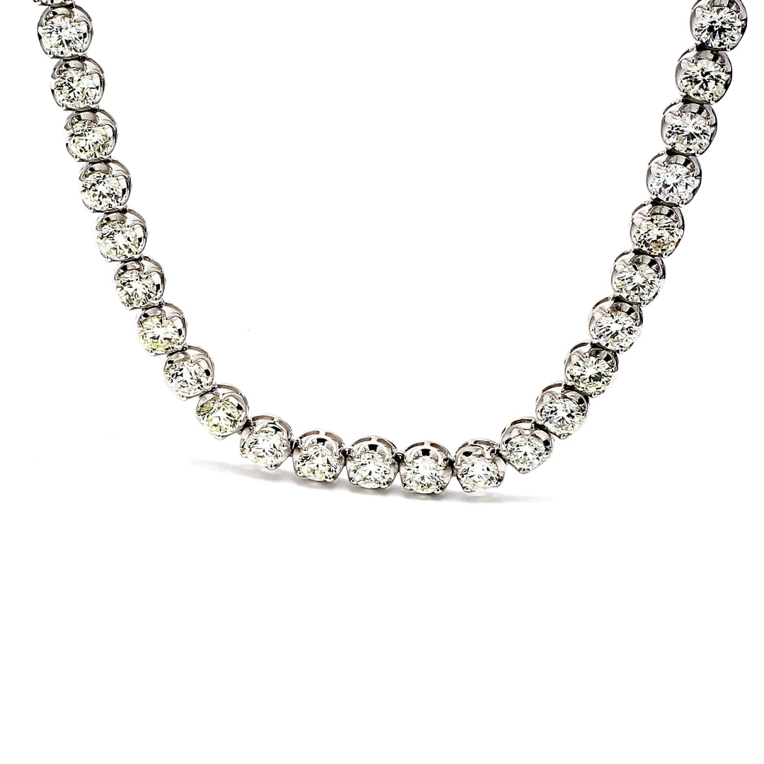 19"" Tennis necklace in 18K WG with crown head prong set (83) round diamonds.  D23.62ct.t.w.
