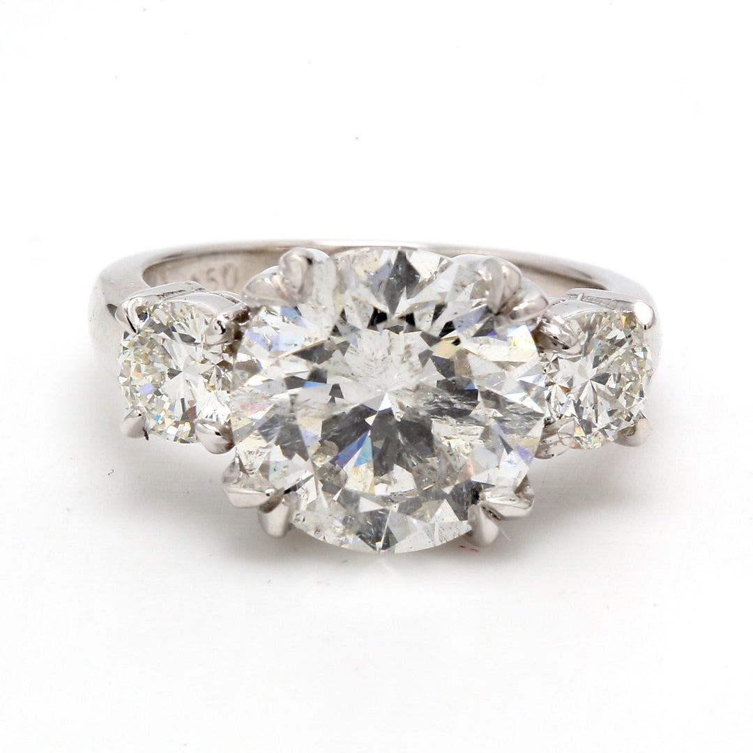 3-stone semi-mount in platinum with claw prong set round diamonds.  D1.00ct.t.w.  Size 6