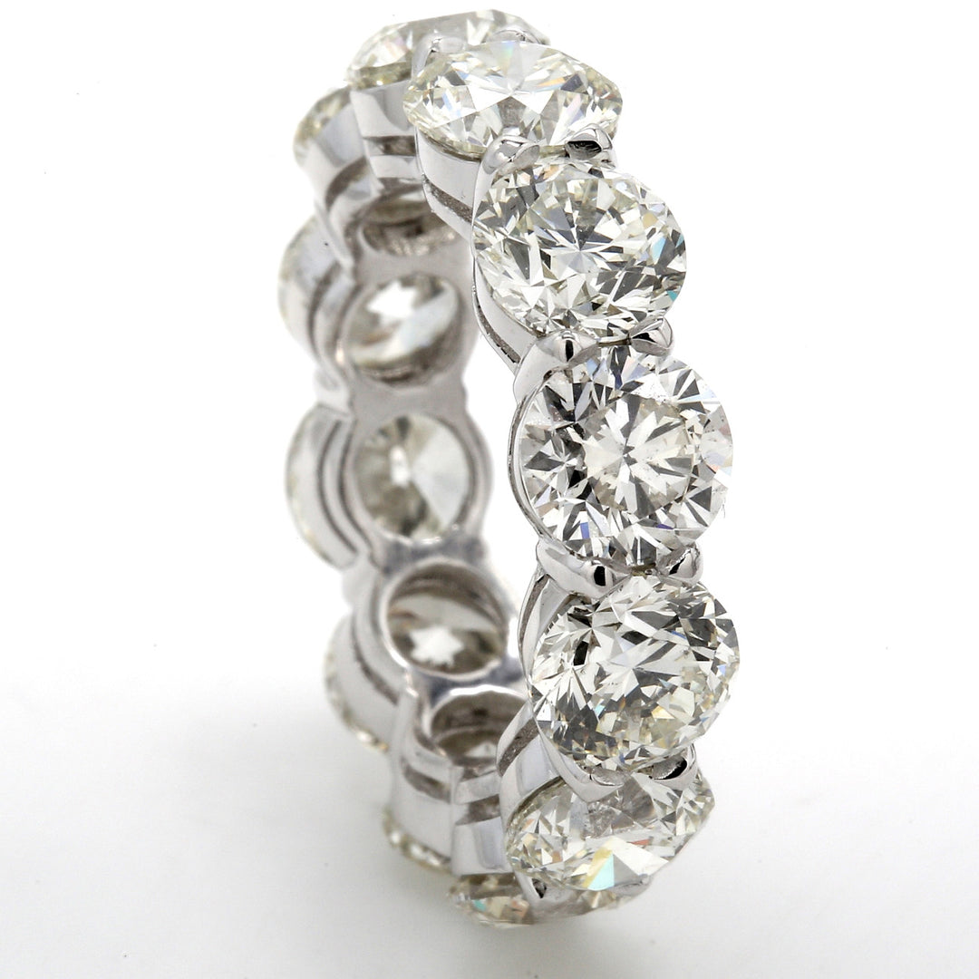 Eternity band in platinum with basket claw prong set I/VS2-SI1 (12) round diamonds.  D10.80ct.t.w.  Size 6.5