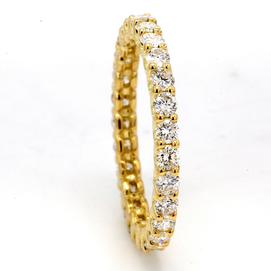 Eternity band in 18K YG with U-prong set (26) round diamonds.  D0.78ct.t.w.  Size 4