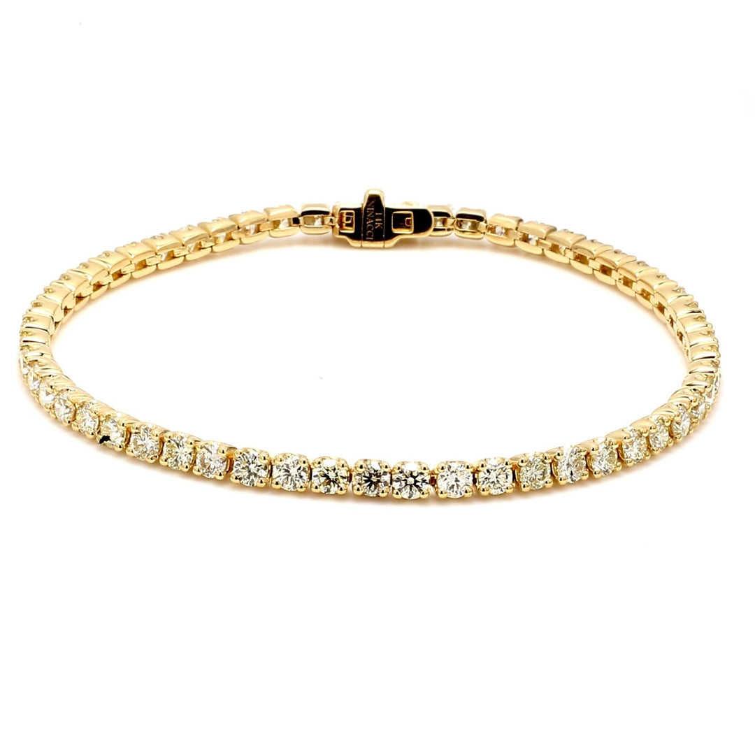 7"" Tennis bracelet in 14K YG with crown head prong set (55) round diamonds.  D5.03ct.t.w.