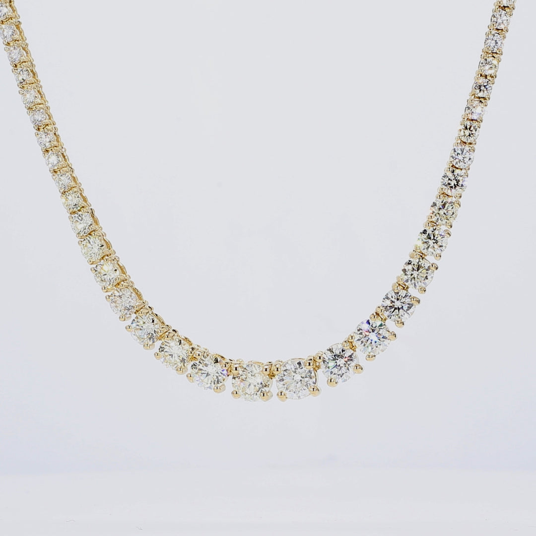 16"" Half way graduated tennis necklace in 14K YG with 4-prong set round diamonds.  D5.56ct.t.w.