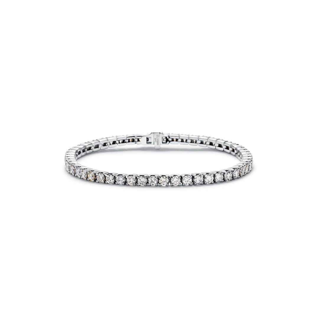 7"" Tennis bracelet with 4-prong set (52) round diamonds.  D6.51ct.t.w.