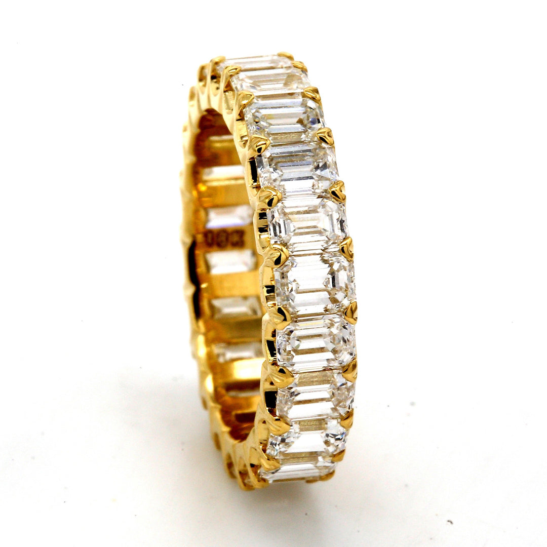 Eternity band in 18K YG with U-prong set (22) emerald cut diamonds.  D4.22ct.t.w.  Size 5.5