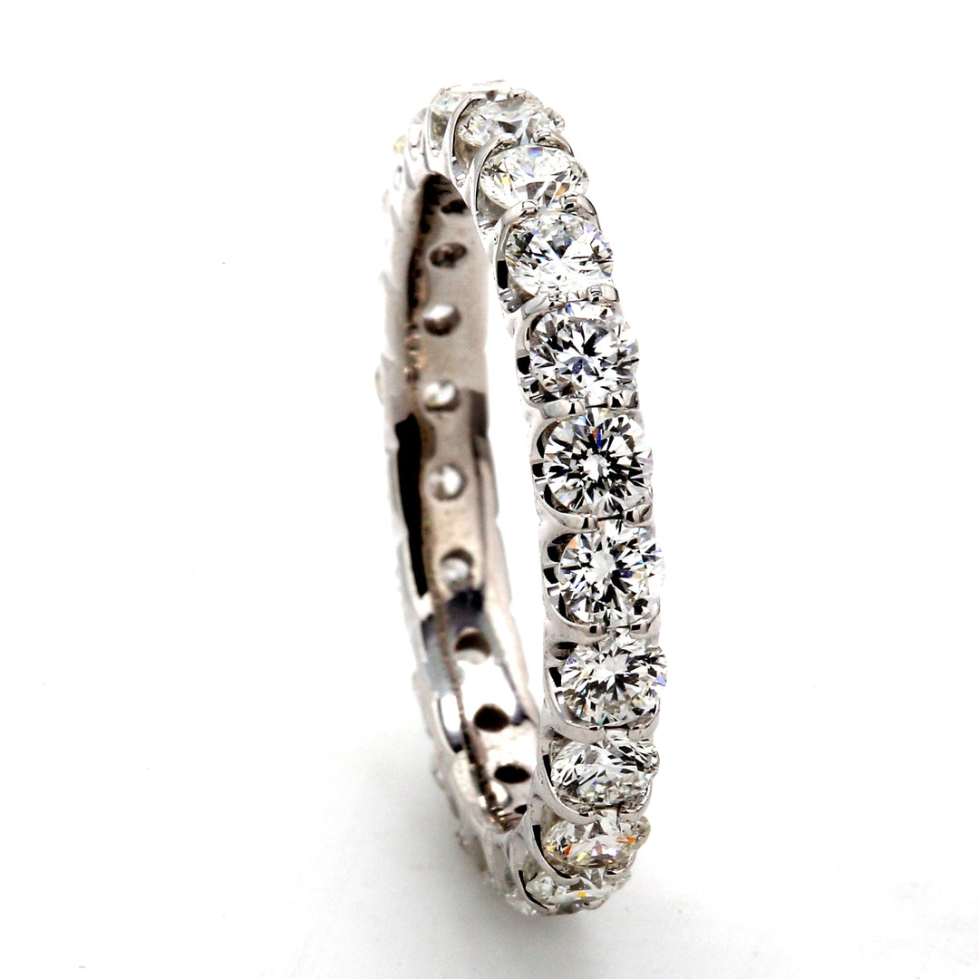 Eternity band in 18K WG with U-prong set (22) round diamonds.  D1.93ct.t.w.  Size 6