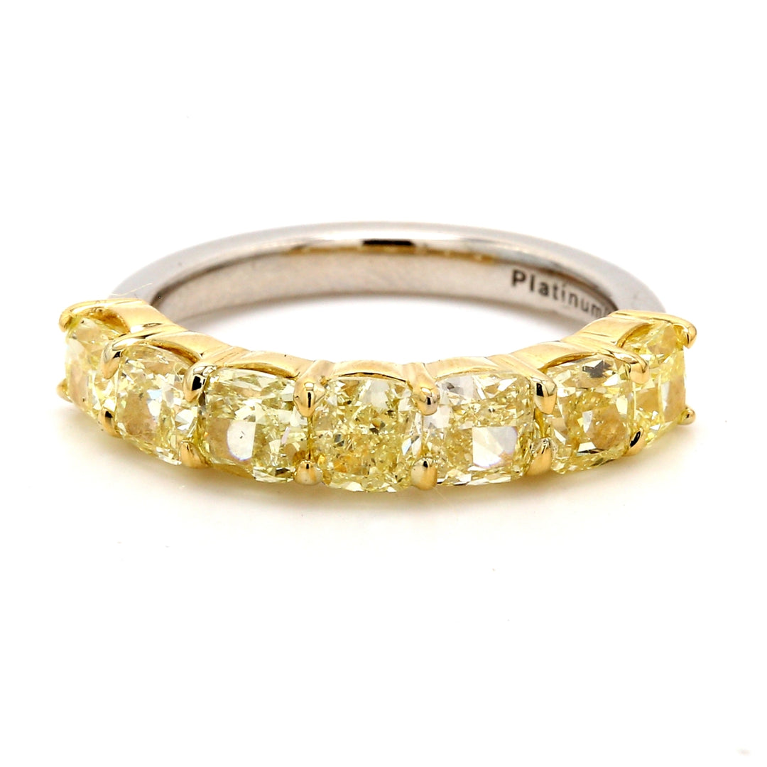7-stone band in platinum and 18K mix with basket prong set fancy yellow cushion cut diamonds.  D2.53ct.t.w.  Size 6