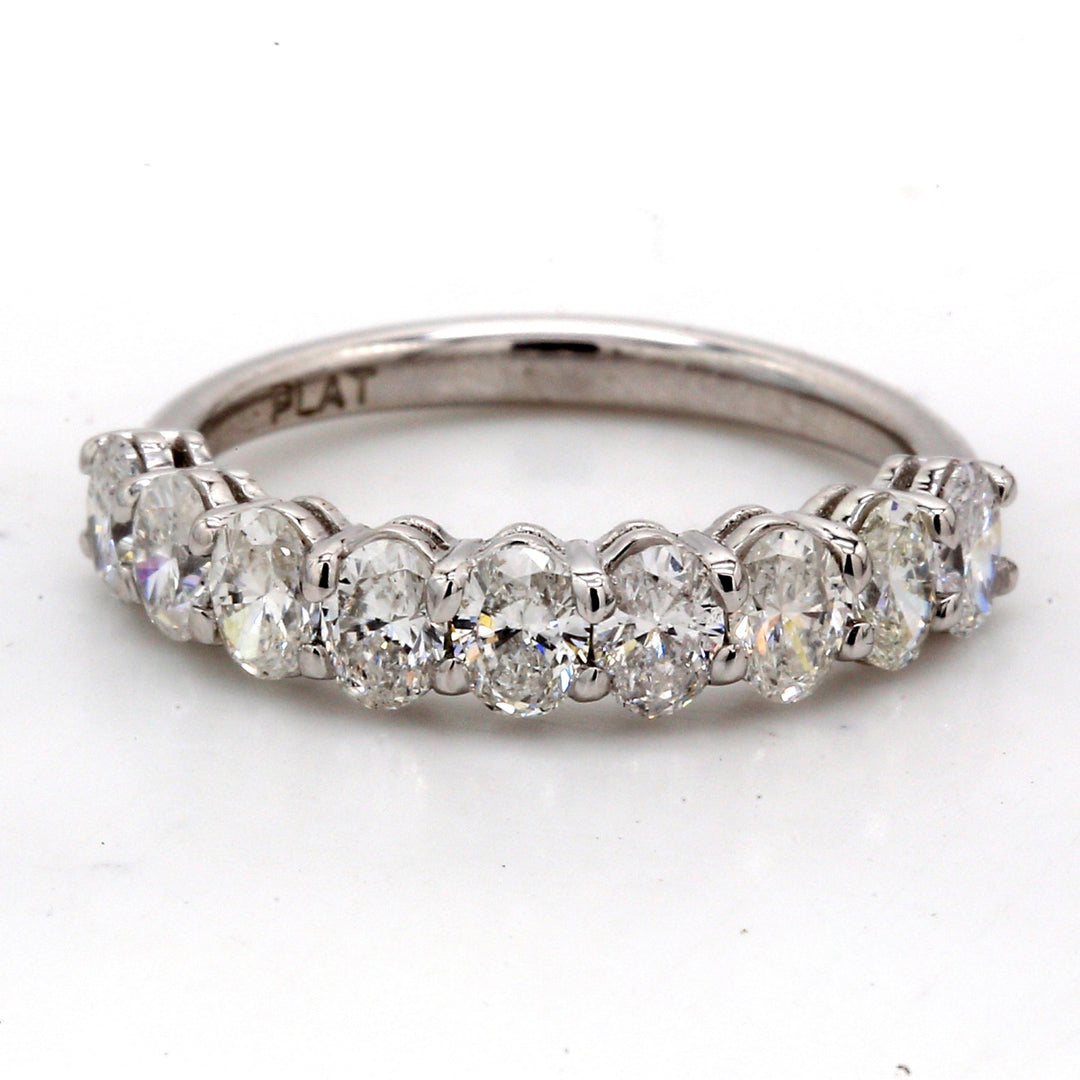 9-stone band in platinum with basket prong set oval cut diamonds.  D1.29ct.t.w.  Size 5.75