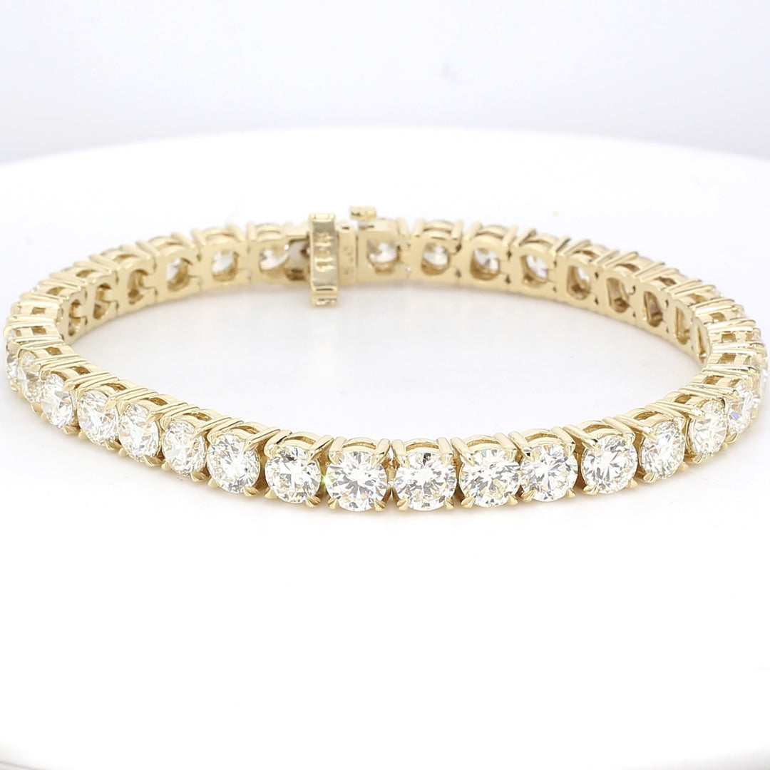 7"" Tennis bracelet in 14K YG with 4-prong basket set round diamonds.  D10.69ct.t.w.