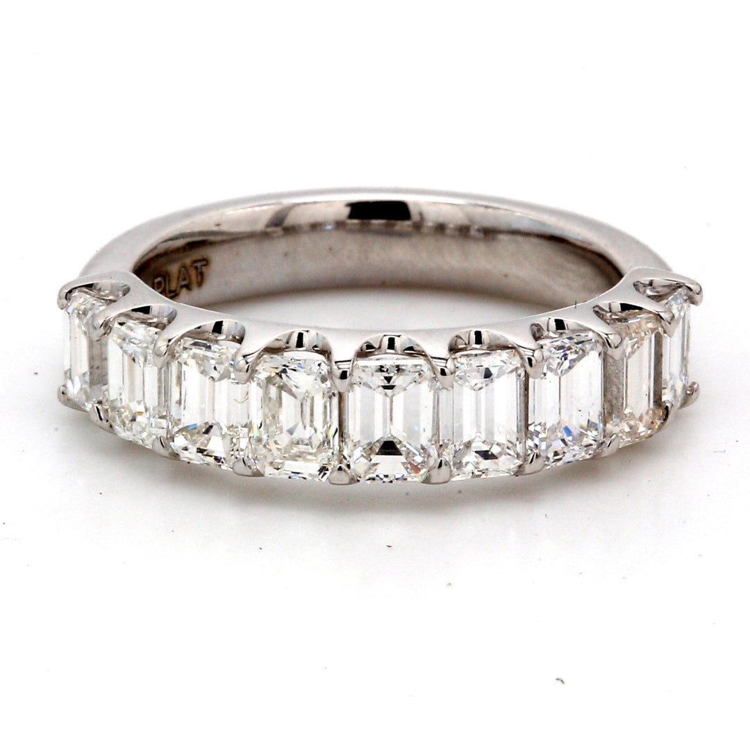 9-stone band in platinum with U-prong set emerald cut diamonds.  D1.76ct.t.w.  Size 5